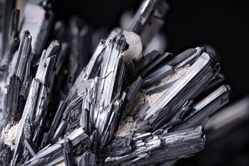 Stibinite crystal. macro detail texture background. close-up raw rough unpolished semi-precious...