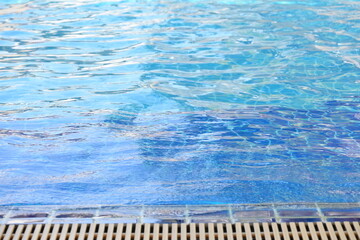 blue swimming pool texture background and surface of water