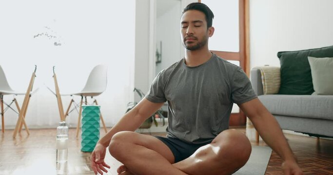 Man, meditation and yoga with mindfulness and zen, prayer and breathing with fitness in lounge. Wellness, health and peace, namaste and calm with exercise at home, spiritual with pilates and lotus