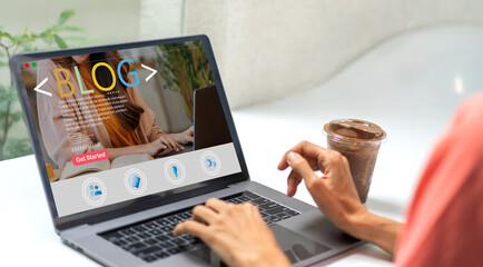 Woman ues laptop computer with social media online content, freelance worker, working online, content creator, blogger, technology, website, woman reading blog online on computer at home