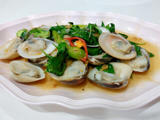 Stir fried clam with basil.