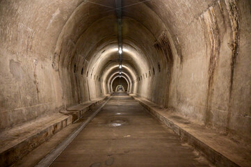 Fototapeta na wymiar A long dark tunnel. Nuclear shelter.