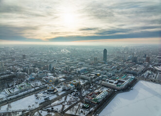 Embankment of the central pond and Plotinka in Yekaterinburg at winter sunset. The historic center of the city of Yekaterinburg, Russia, Aerial View