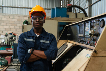 Portrait of female automation engineer standing and looking camera in industrial factory.	