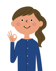 OKサインを出す若い女性