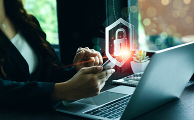 cybersecurity concept Businessmen protecting personal data on laptops and virtual interfaces. Lock...