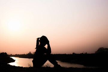 Silhouette of woman praying over beautiful sky background
- 646226372