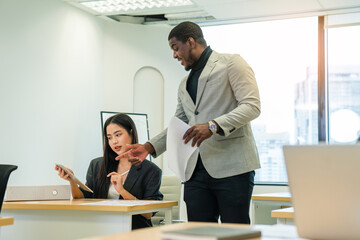 Leader or businessman sends documents male colleague in the creative office.