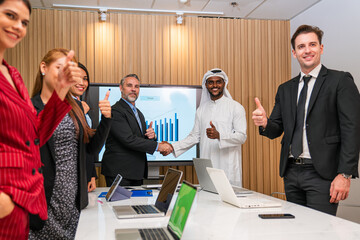 Group of professional business people are working and shaking hands while working in the creative office.