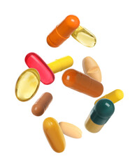 Many different colorful pills falling on white background