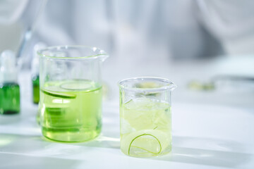 eco skin care beauty products in cosmetic laboratory development, Natural drug research with organic plant and scientific extraction in glassware, Alternative green herb medicine for body health care