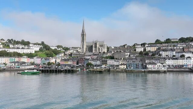 Wide panorama the view from water, Cobh town near Cork in Ireland. Cathedral tower