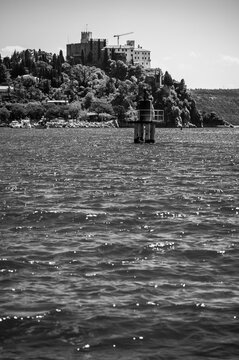 Between sea and lagoon. Sailing trip between the Marano lagoon and the Gulf of Trieste. Black and white.