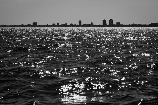 Between sea and lagoon. Sailing trip between the Marano lagoon and the Gulf of Trieste. Black and white.