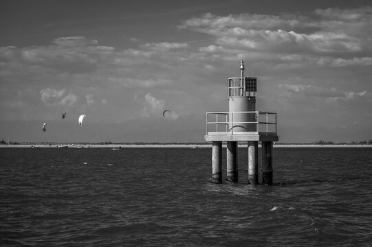 Between sea and lagoon. Sailing trip between the Marano lagoon and the Gulf of Trieste. Black and white.