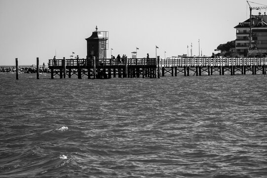 Between sea and lagoon. Sailing trip between the Marano lagoon and the Gulf of Trieste. Black and white.