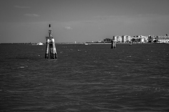 Between sea and lagoon. Sailing trip between the Marano lagoon and the Gulf of Trieste. Black and white.