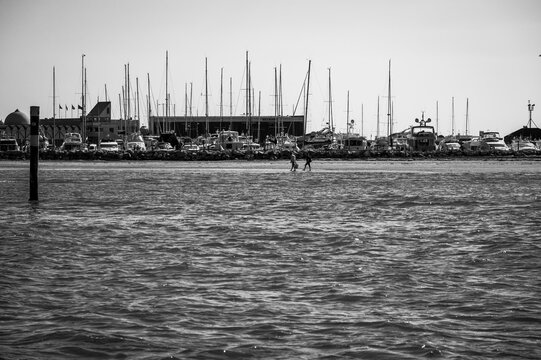 Between sea and lagoon. Sailing trip between the Marano lagoon and the Gulf of Trieste. Black and white.