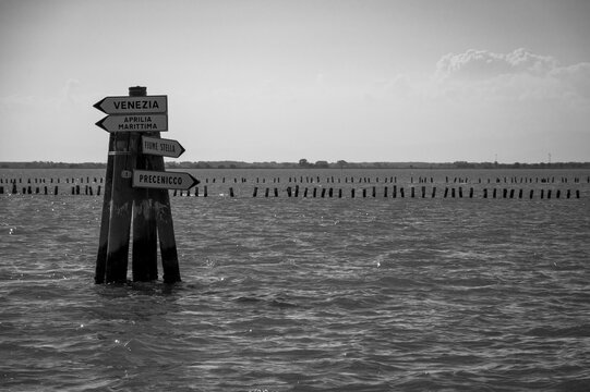Between sea and lagoon. Sailing trip between the Marano lagoon and the Gulf of Trieste. Black and white.