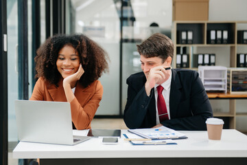 Portrait of success business people working together in home office. Couple teamwork startup concept