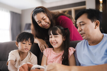 Big family with many generation of people are meeting at home. Grandmother and Grandfather with Father and Mother having relax with Children daughter group, smile bonding and happy