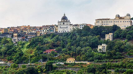 Castel Gandolfo city skyline with famous dome of San Tommaso da Villanova church with Papal summer residence and astronomical observatory with its white domes