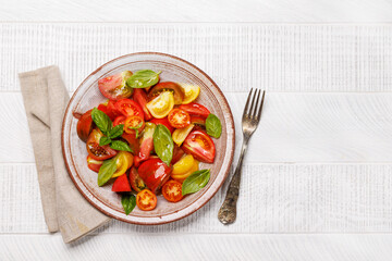 Tomato salad with fresh basil and olive oil