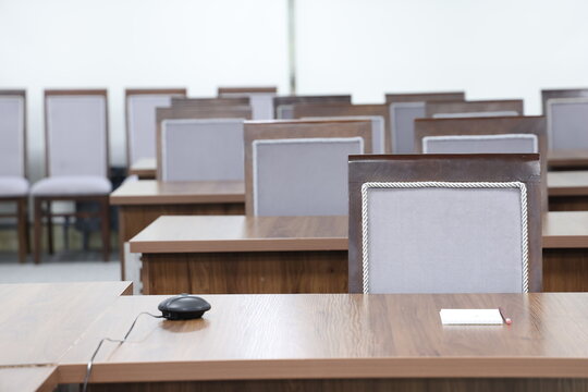 Empty chairs and table in the auditorium or conference room, stock photo