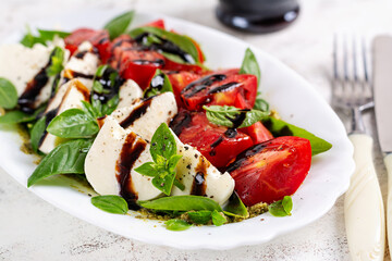 Caprese salad tomato for concept design. White background, close up. Food concept.