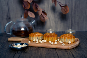 Chinese mid-autumn mooncake festival with egg yolk and tea