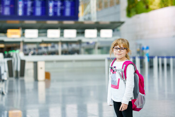 Little Tired Preschool Girl at Airport Terminal. Cute Sad Child After Long Flight with Airplane.
