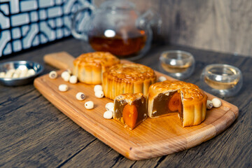 Chinese mid-autumn mooncake festival with egg yolk and tea