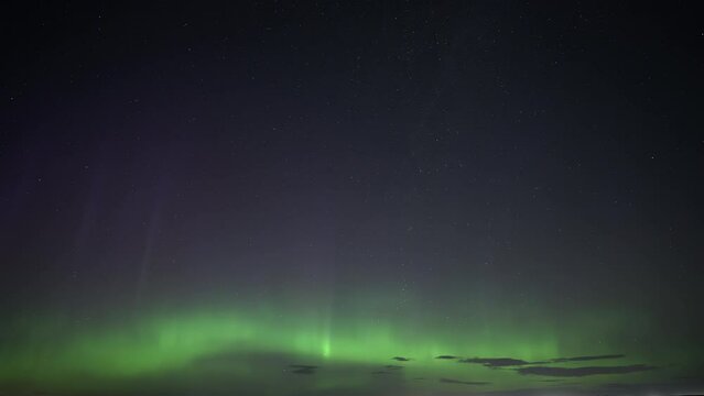 Aurora Borealis shining on the starry night. Timelapse. 