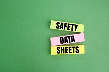 colored paper with the word SAFETY DATA SHEETS (SDS). Safety & Health at Work Concepts