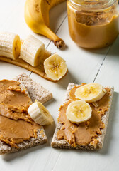 Diet breads with peanut butter and banana. A healthy snack.