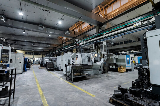 Technicians with modern machines working in metal work industry