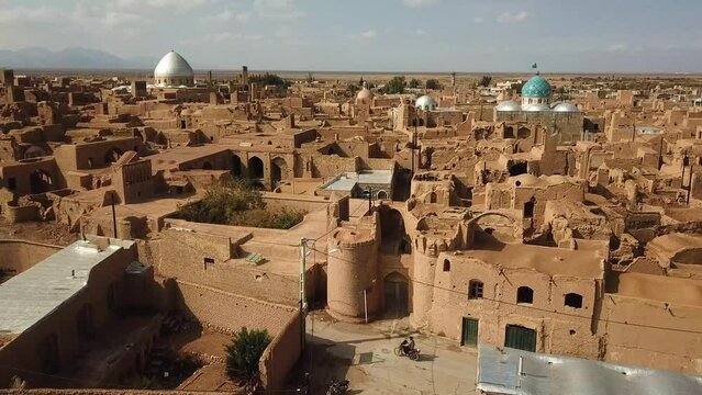 wonderful ancient architecture design in historical city of aqda in Yazd in Iran town in castle adobe houses mud brick structure clay building travel to history and frozen ruins of civilization iran