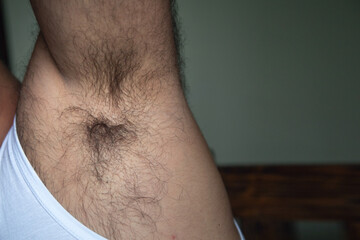 Closeup of hairy caucasian male armpit. - obrazy, fototapety, plakaty