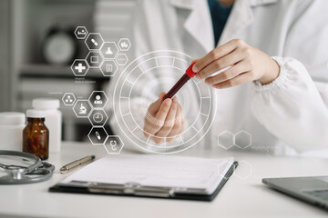 Doctor analysis the blood test examination results and medication usage of the patient on the chart, medical check-up concept.