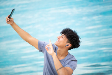 happy man taking selfie with mobile phone