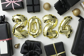 New Year 2024 with golden balloons with gifts