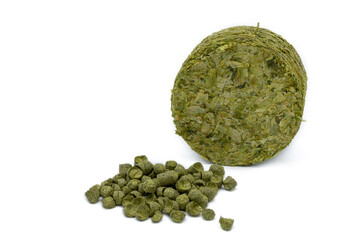 Pile of Czech hop pellets and hop puck on white background - Czech Republic, Europe - obrazy, fototapety, plakaty