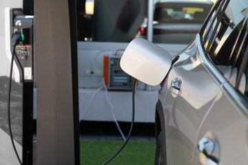 Close-up of an electric car with a cable