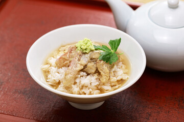 Tai chazuke is a traditional Japanese cuisine.
Sea bream sashimi dipped in sesame sauce on top of rice and served with bancha tea poured over the top.