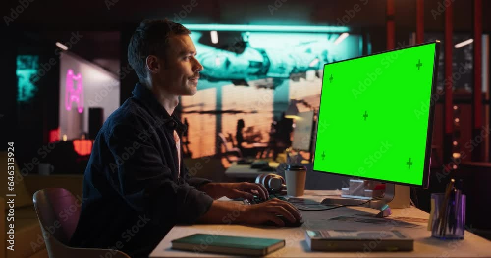 Poster Portrait of Male Working in Creative Agency Office, Checking Data and Sending E.Mails. Successful Specialist Using Desktop Computer with Green Screen Mock Up Display During Night