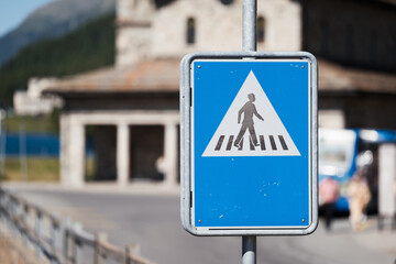 Traffic sign pedestrian crossing road, crosswalk symbol on city background