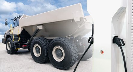 Electric charging station on a background of electric mining truck. Concept.