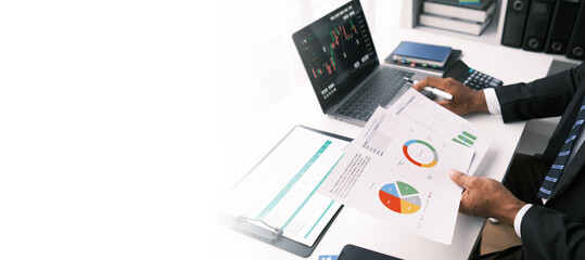 Businessman trading online stock market on computer laptop screen, digital investment concept