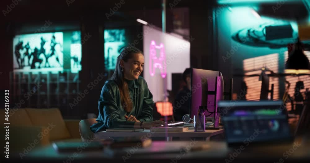 Aufkleber Expressive Female Sitting Working on Computer in the Evening in Game Development Company. Excited Producer is Happy and Celebrating Her Video Game Receiving Good Rates Upon Distribution