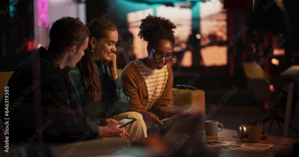Poster Slow Motion Portrait of Multiethnic Group of People Working on Developing Growth Ideas Based on Data. Energetic Teammates in a Creative Meeting Room in an Office Using Tablet and Laptop